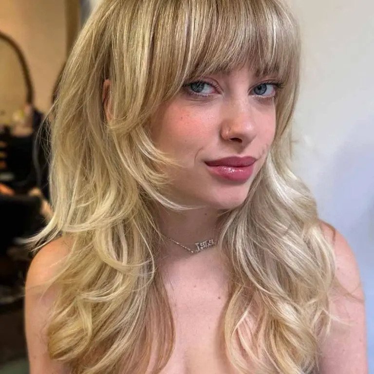 Long Blonde Wolf Cut with Blunt Bangs