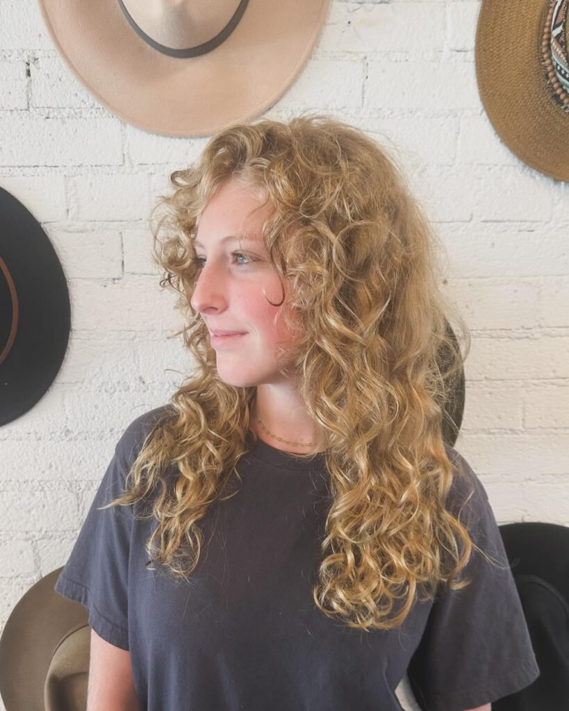 Medium Curly Gypsy Shag Cut With Side Swept Bangs