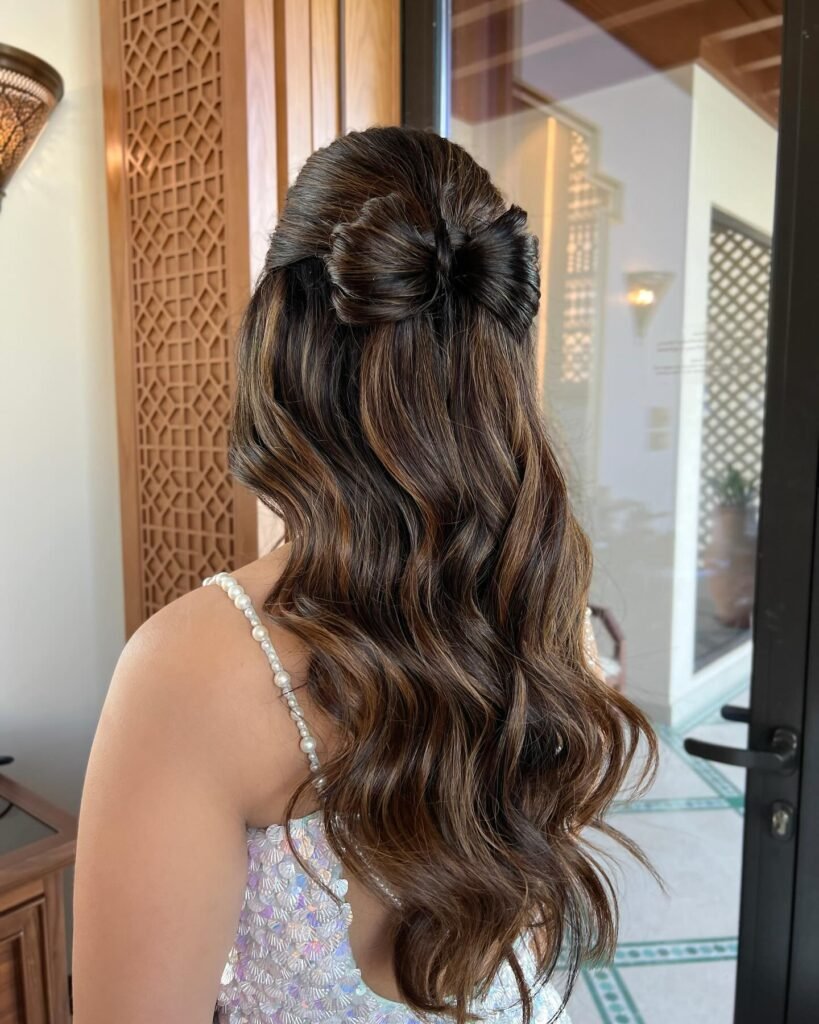 1. Half Up Half Down Bow Hairstyle With Wavy Brown Balayage
