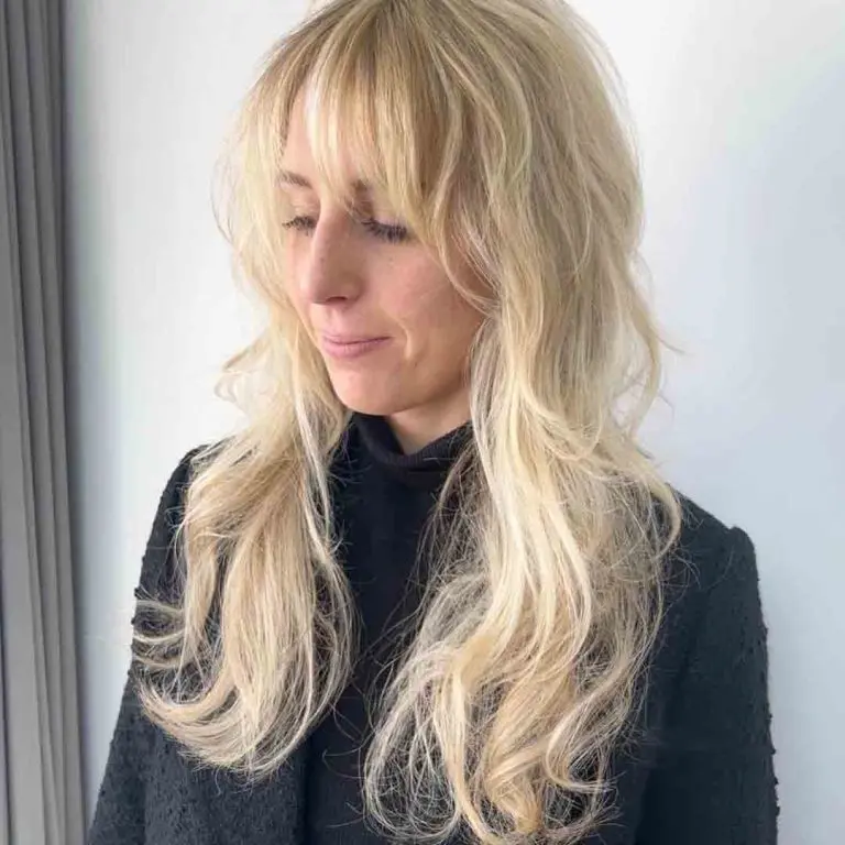 Long Blonde Wavy Wolf Cut With Extended Bangs