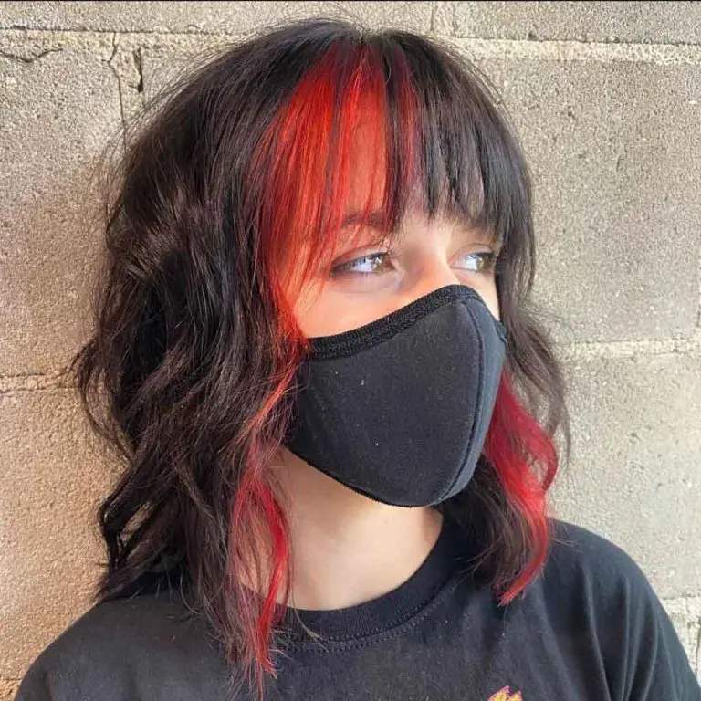 Short Wavy Black Wolf Cut With Red and Black Choppy Bangs