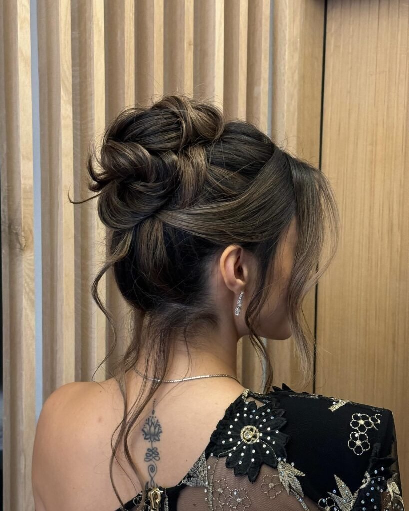 Wavy Messy Bronde Tucked in Low Bun
