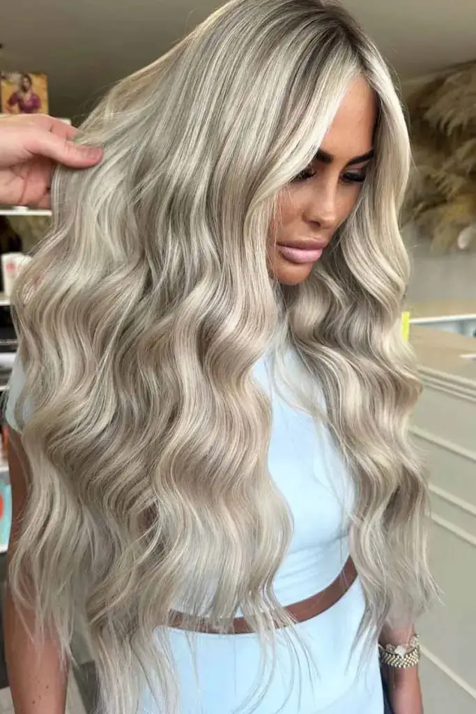 Luxurious Blonde Curls With Dimensional Low Lights
