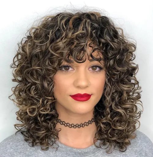 Mid-Length Curly Hairstyle with Curly Bangs