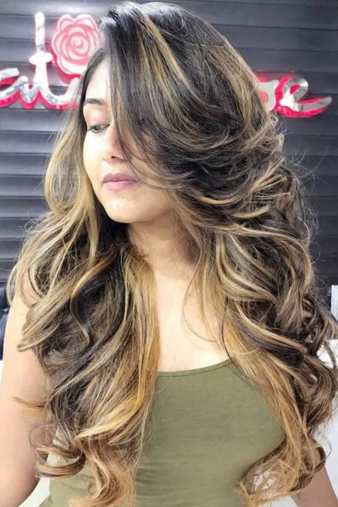  Voluminous Curls With Golden Highlights