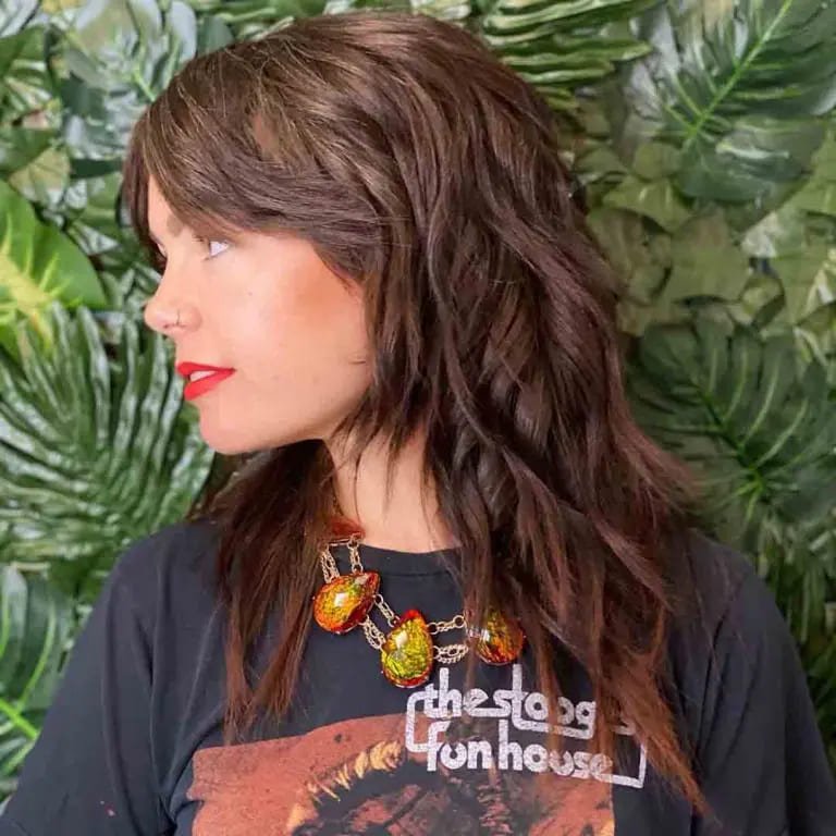  Brown Layered Shag Cut With Side-Swept Bangs
