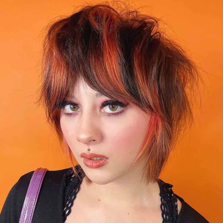  Razor Wolf Cut on Duo-Toned Hair With Curtain Bangs
